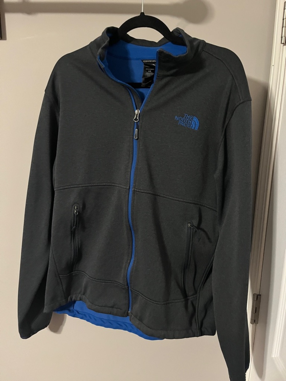 The North Face Charcoal Gray Jacket with Blue Trim